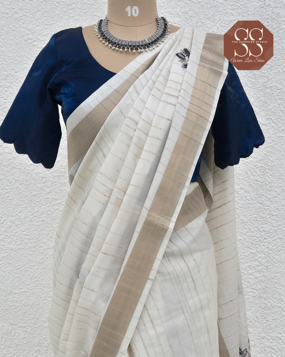 Styled Look: Tussar Saree with Hand Embroidery & Gold Border + Navy Blue Ready-Made Blouse