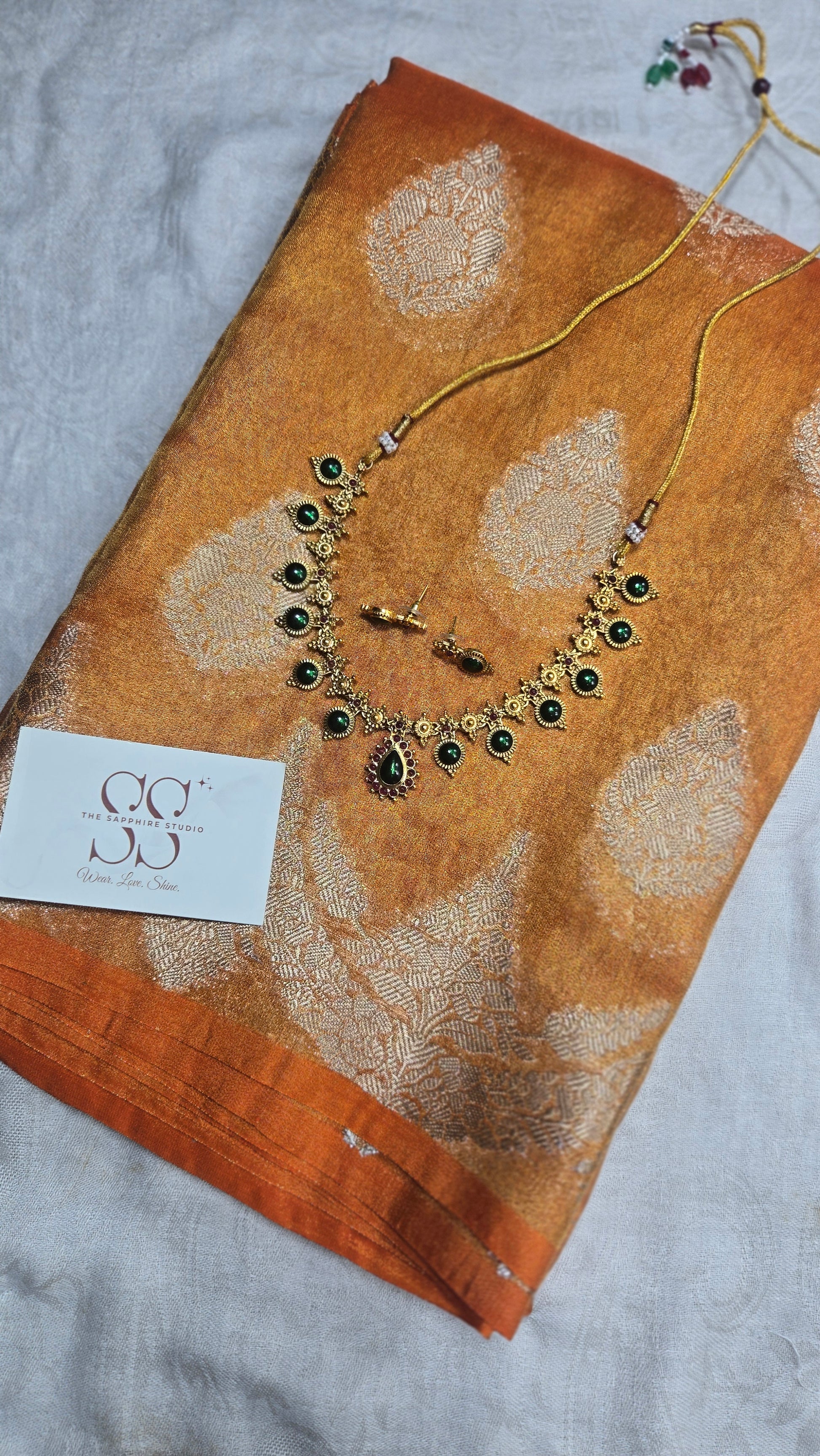 Styled Look: Orange Banarasi Tissue Saree + Emerald Temple Necklace Set