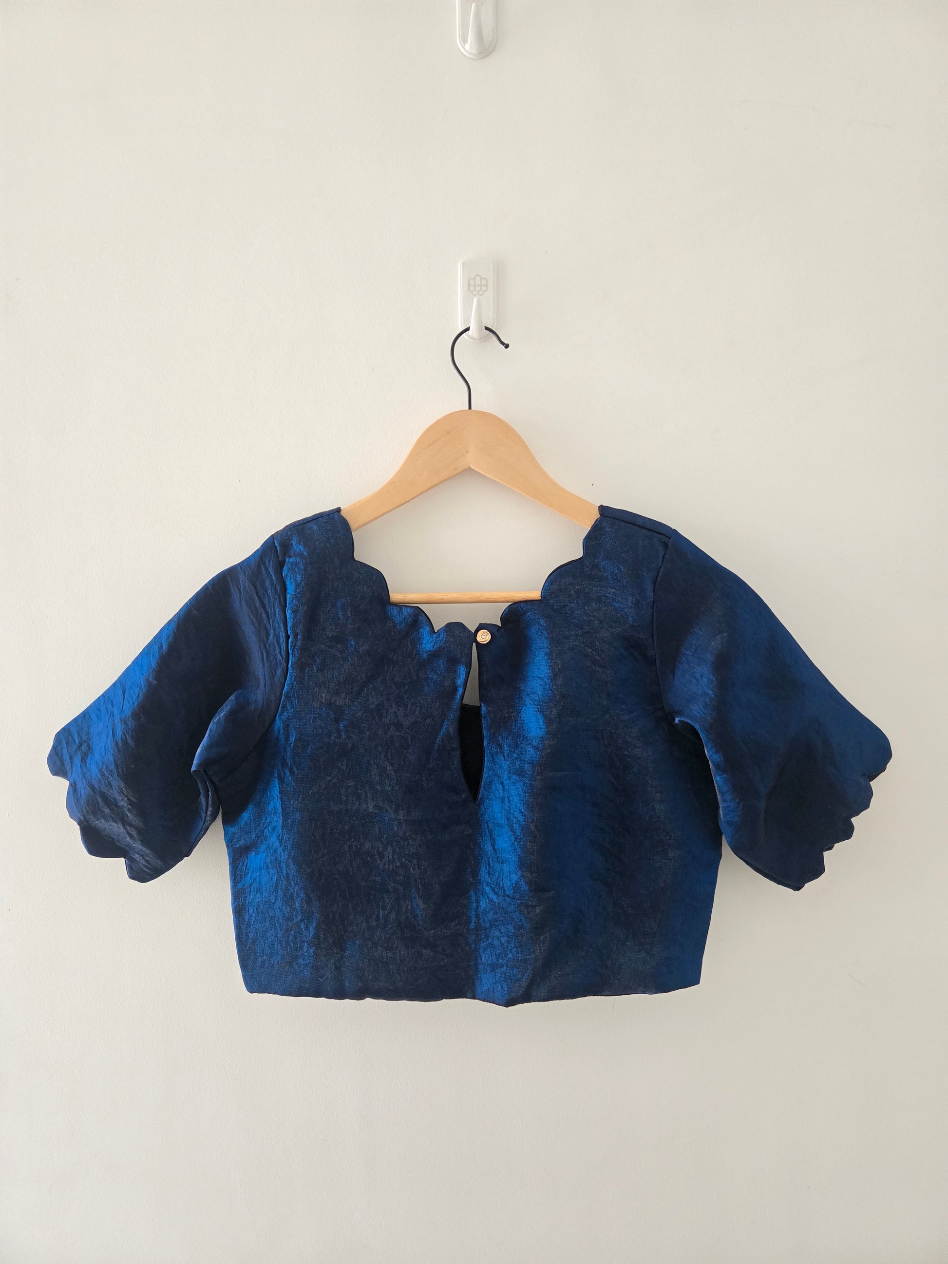 Onam Tussar Saree – Hand Embroidery & Elegant Lace Border with the paired navy scallop blouse
