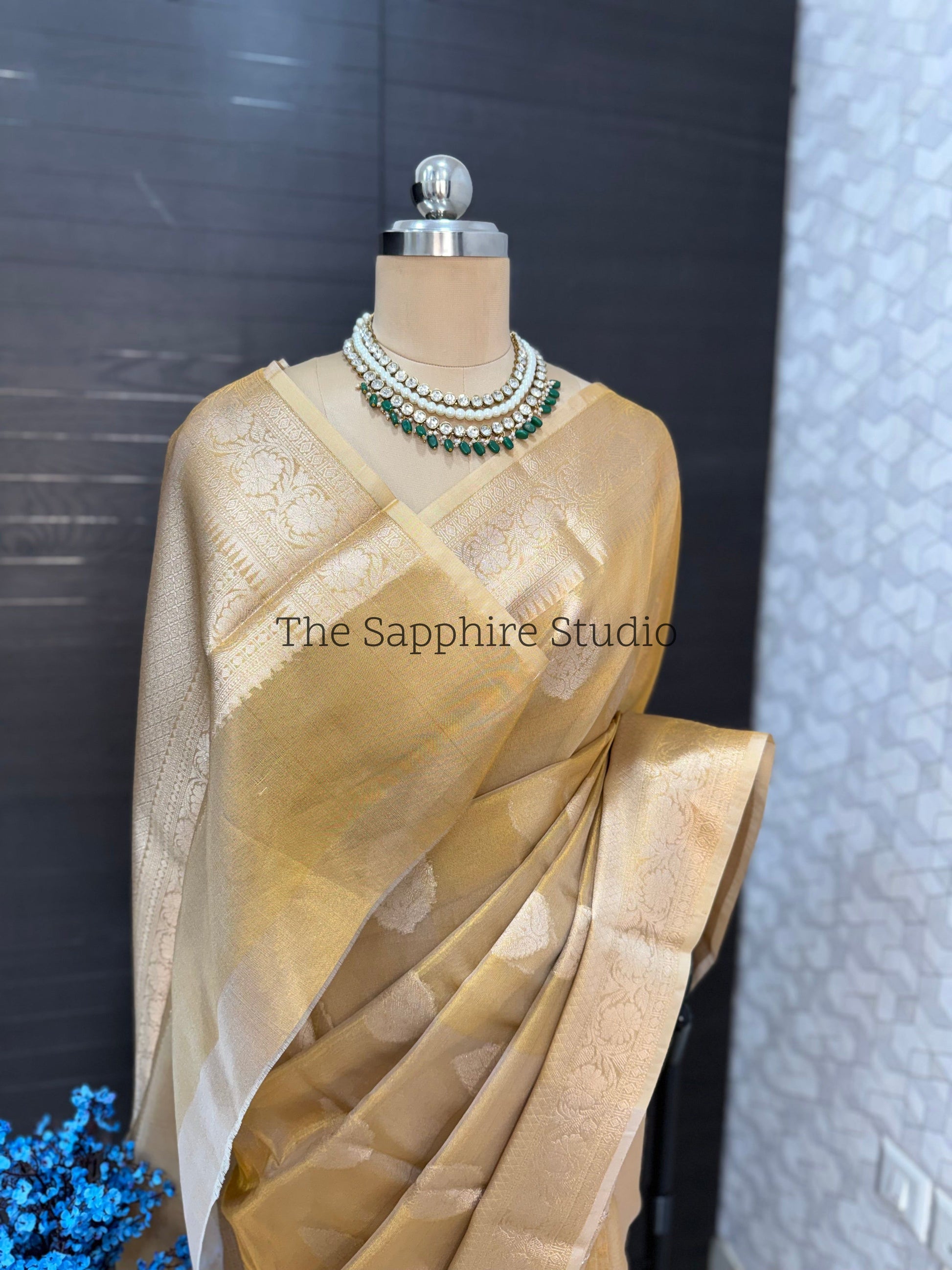Golden Banarasi Tissue saree with contrast green blouse