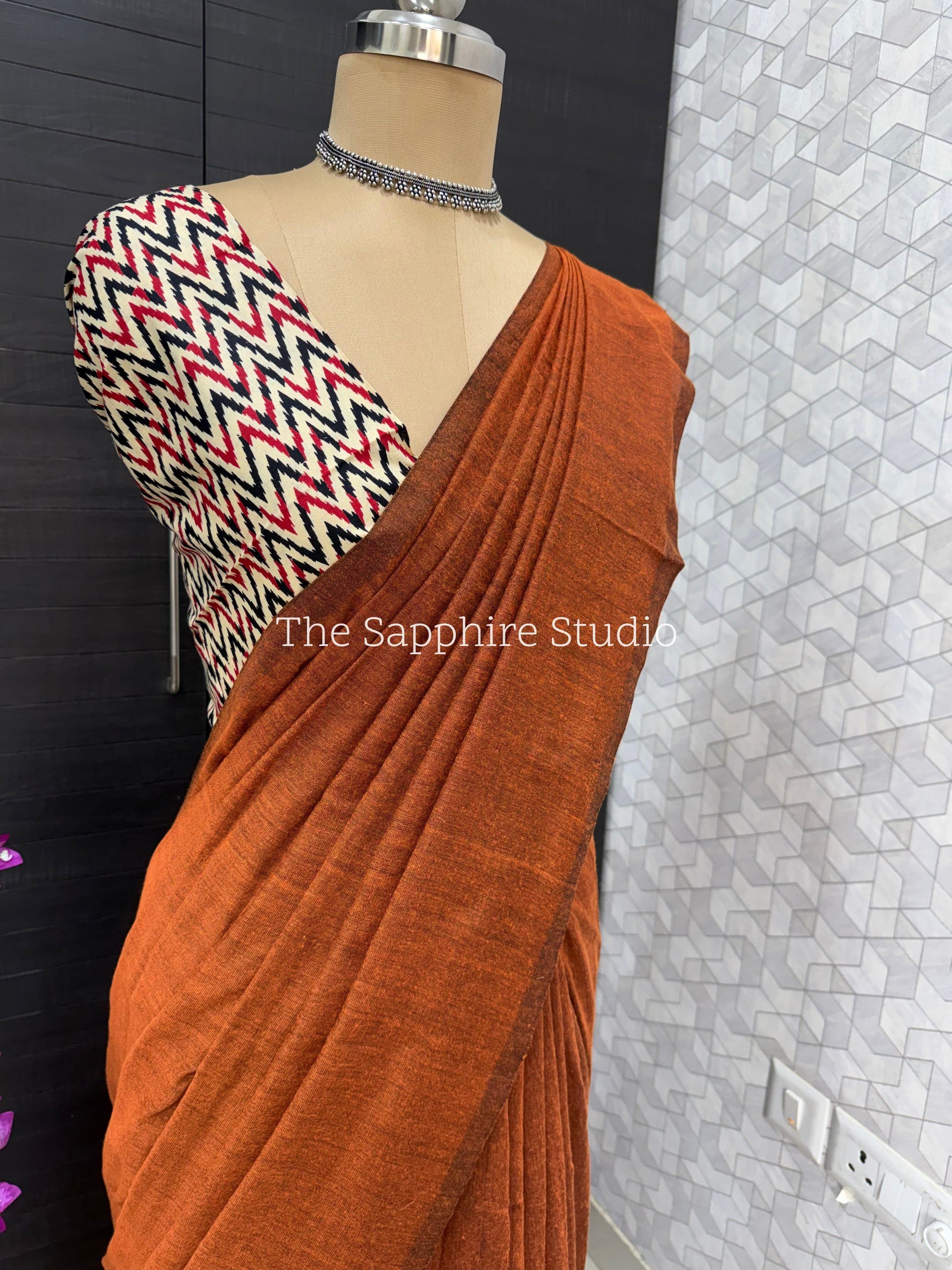Rust Orange khadi cotton saree with Geometric Contrast Blouse