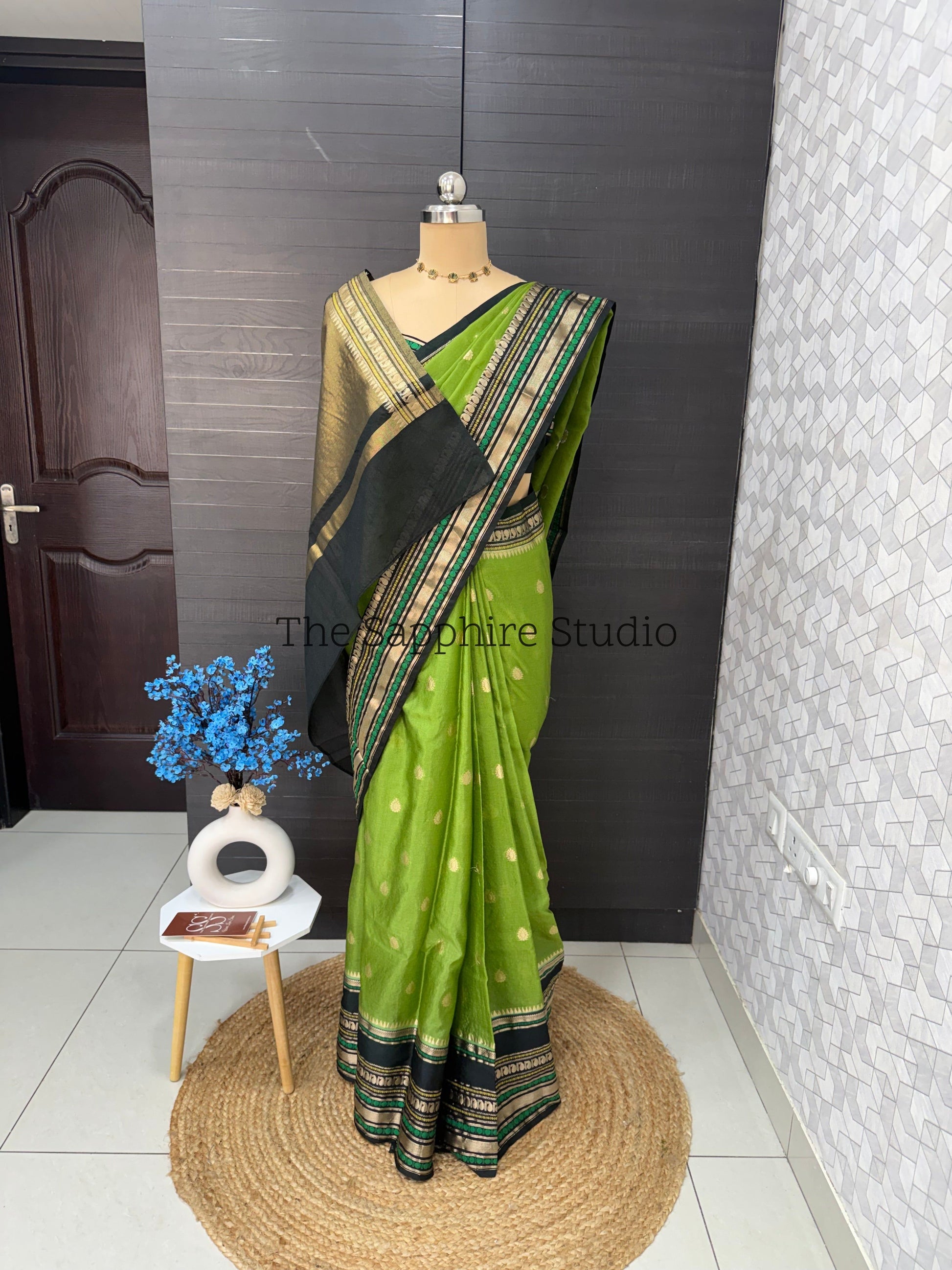leafy green silk saree with black contrast border and gold zari, Banarasi Chiniya saree for haldi and festive wear, elegant traditional saree India