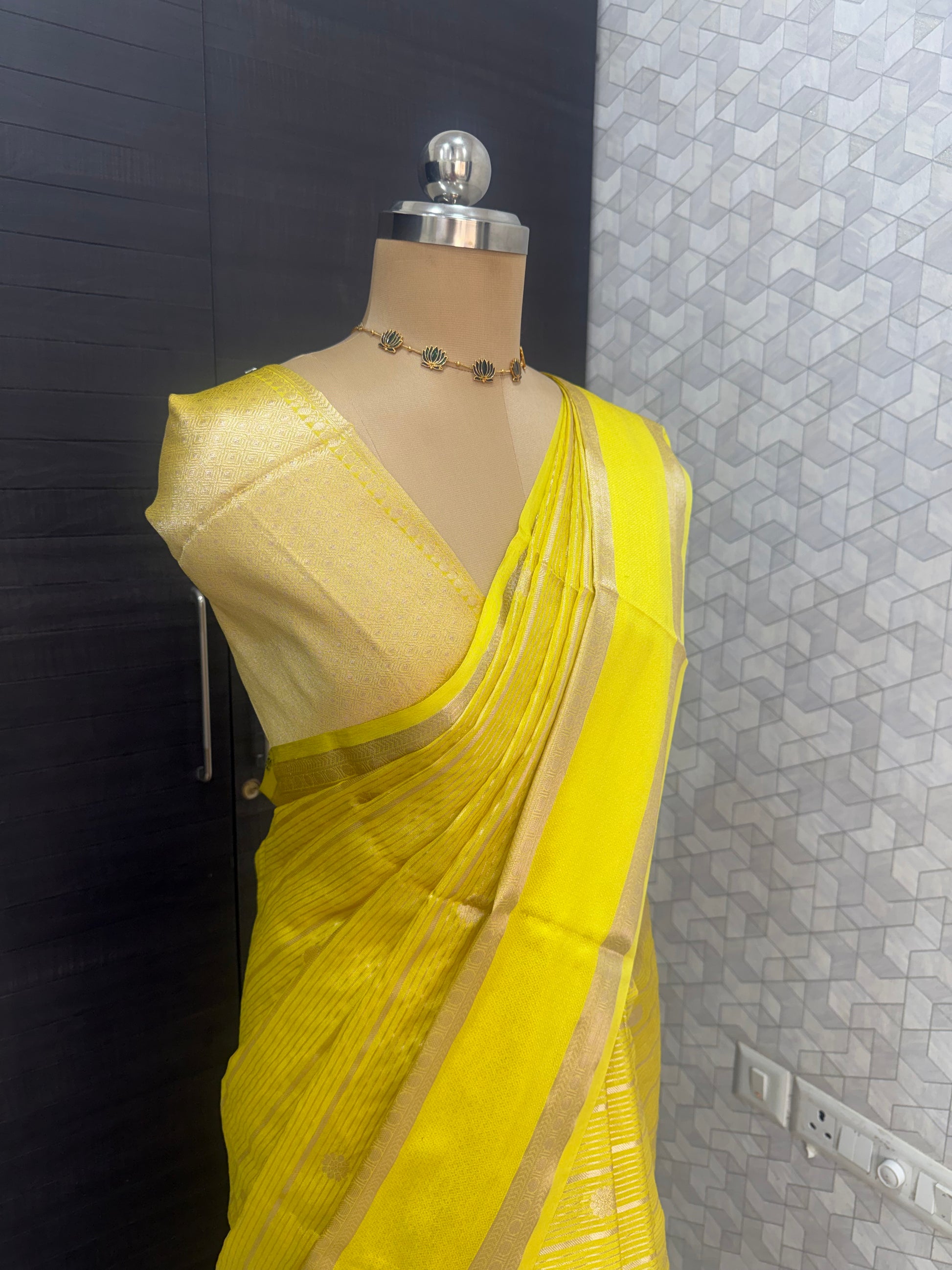 bright yellow Banarasi silk saree with all-over zari buti weaving and border, elegant haldi saree for wedding and festive occasions