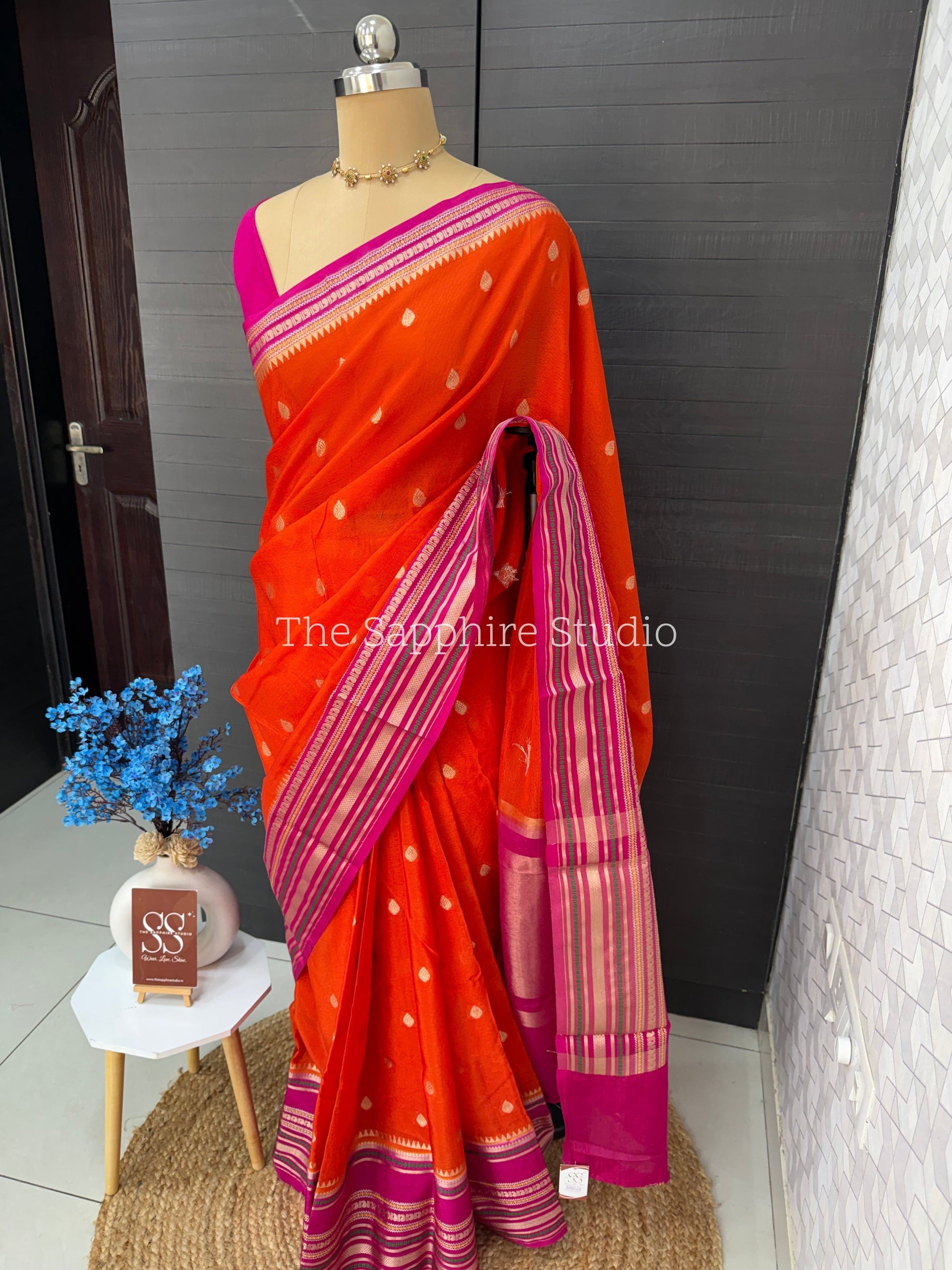 orange Banarasi Chiniya silk saree with pink zari border and butta work, lightweight festive saree for weddings, pujas and cultural celebrations