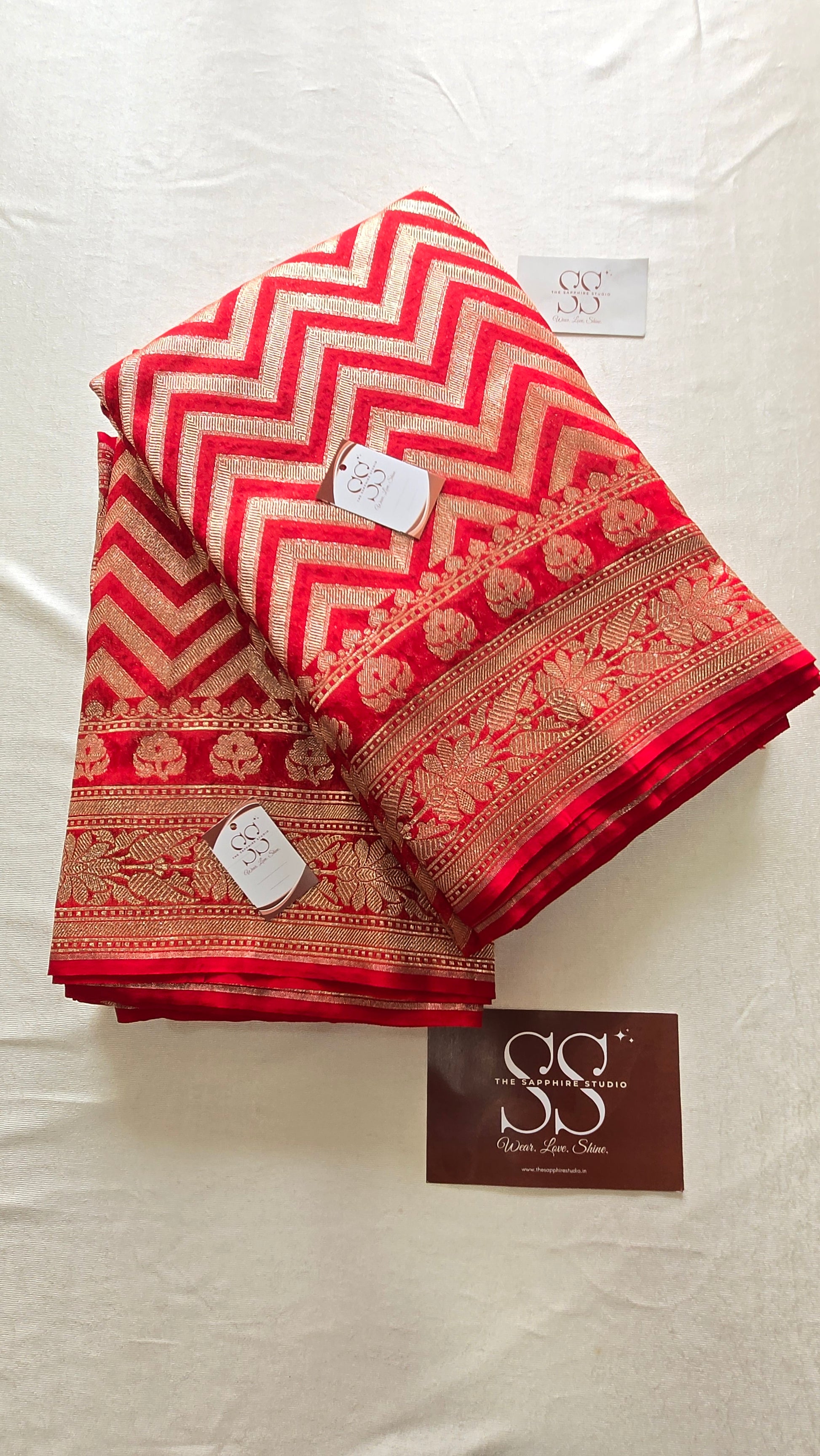 red Banarasi georgette saree with zig-zag zari design and floral pallu, lightweight festive saree for weddings, pujas and cultural celebrations